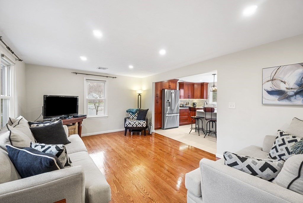 60 Hitching Post Drive Walpole, MA 02081 - Photo 4 of 37 a living room with furniture and a flat screen tv