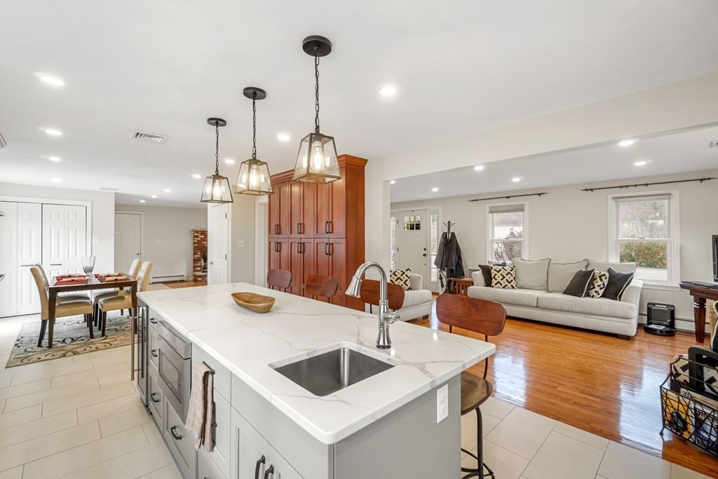 60 Hitching Post Drive Walpole, MA 02081 - Photo 7 of 37 a large kitchen with a counter space a sink appliances and living room view