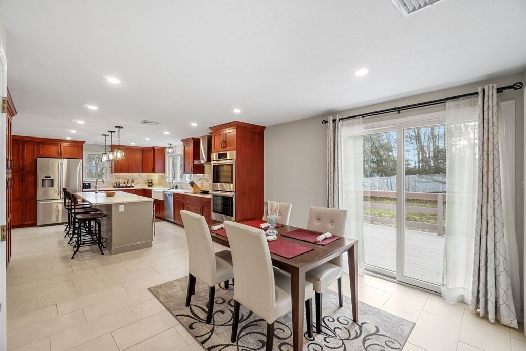 60 Hitching Post Drive Walpole, MA 02081 - Photo 10 of 37 a view of a dining room with furniture window and outside view