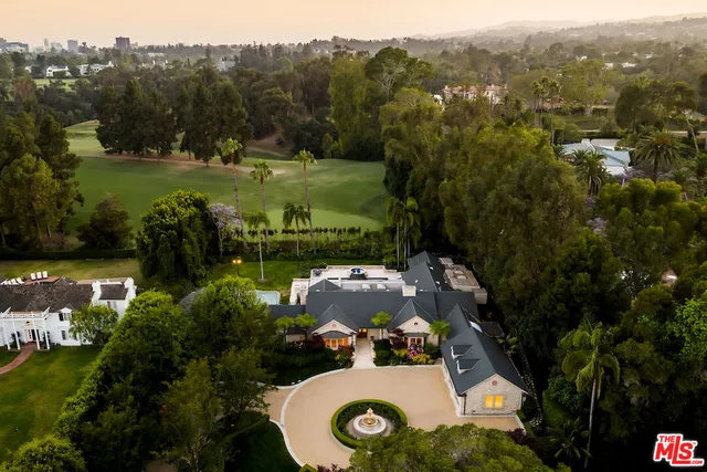 an aerial view of a house with yard