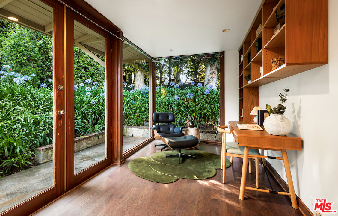 9996 Sunset Boulevard Beverly Hills, CA 90210 - Photo 21 of 35 a view of a livingroom with furniture wooden floor and windows