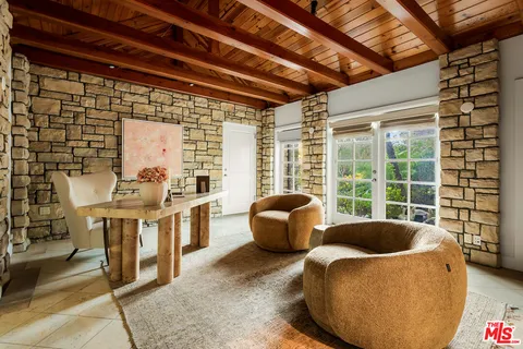 a view of a kitchen with furniture and windows