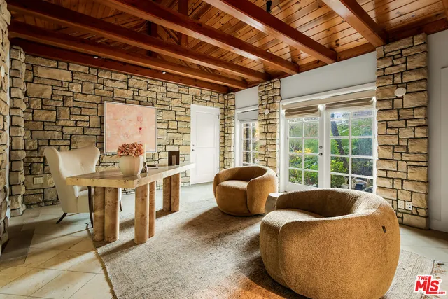a view of a kitchen with furniture and windows