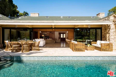 a view of a swimming pool with a patio