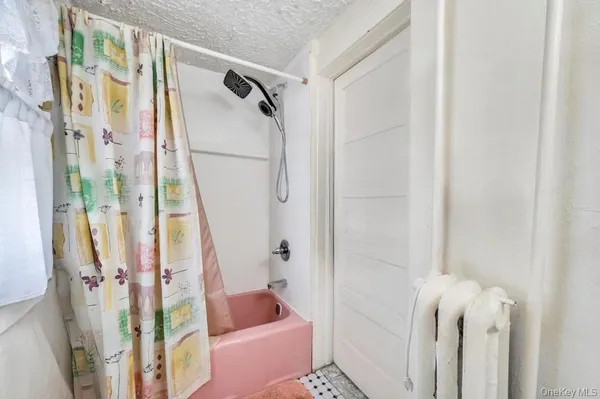 a bathroom with a shower curtain