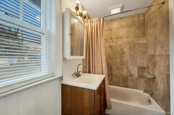 a bathroom with a sink and a bathtub