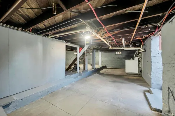 a view of empty room with wooden ceiling