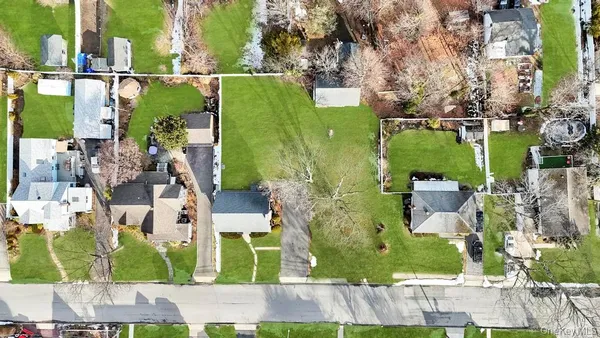 an aerial view of a houses with outdoor space
