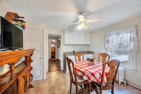 a dining room with furniture and window