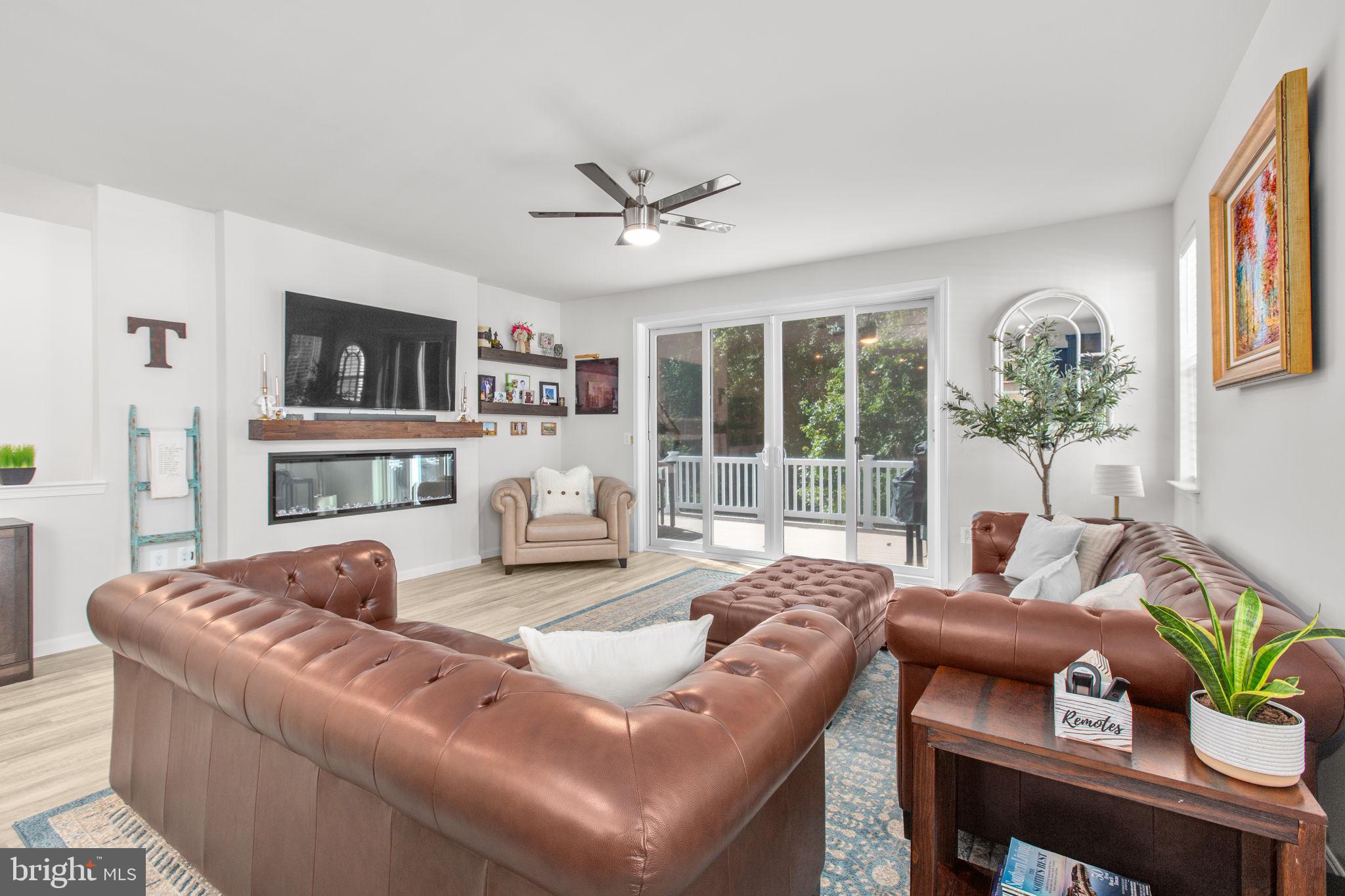 6306 Bobcat Lane King George, VA 22485 - Photo 11 of 58 a living room with furniture fireplace and a flat screen tv