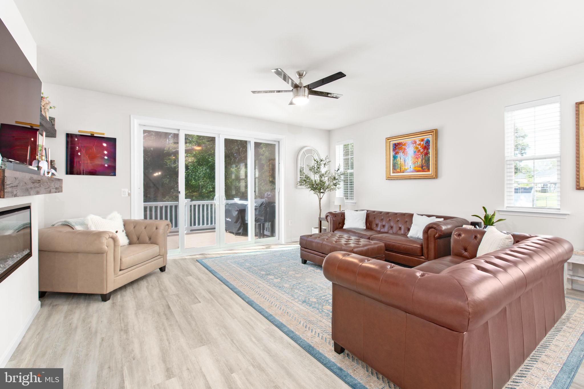 6306 Bobcat Lane King George, VA 22485 - Photo 12 of 58 a living room with furniture and a large window
