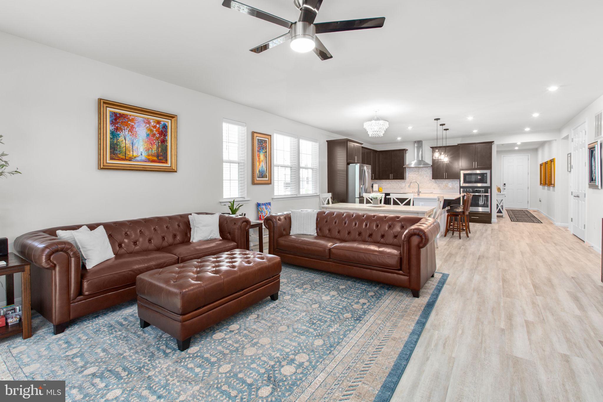 6306 Bobcat Lane King George, VA 22485 - Photo 13 of 58 a living room with furniture and kitchen view