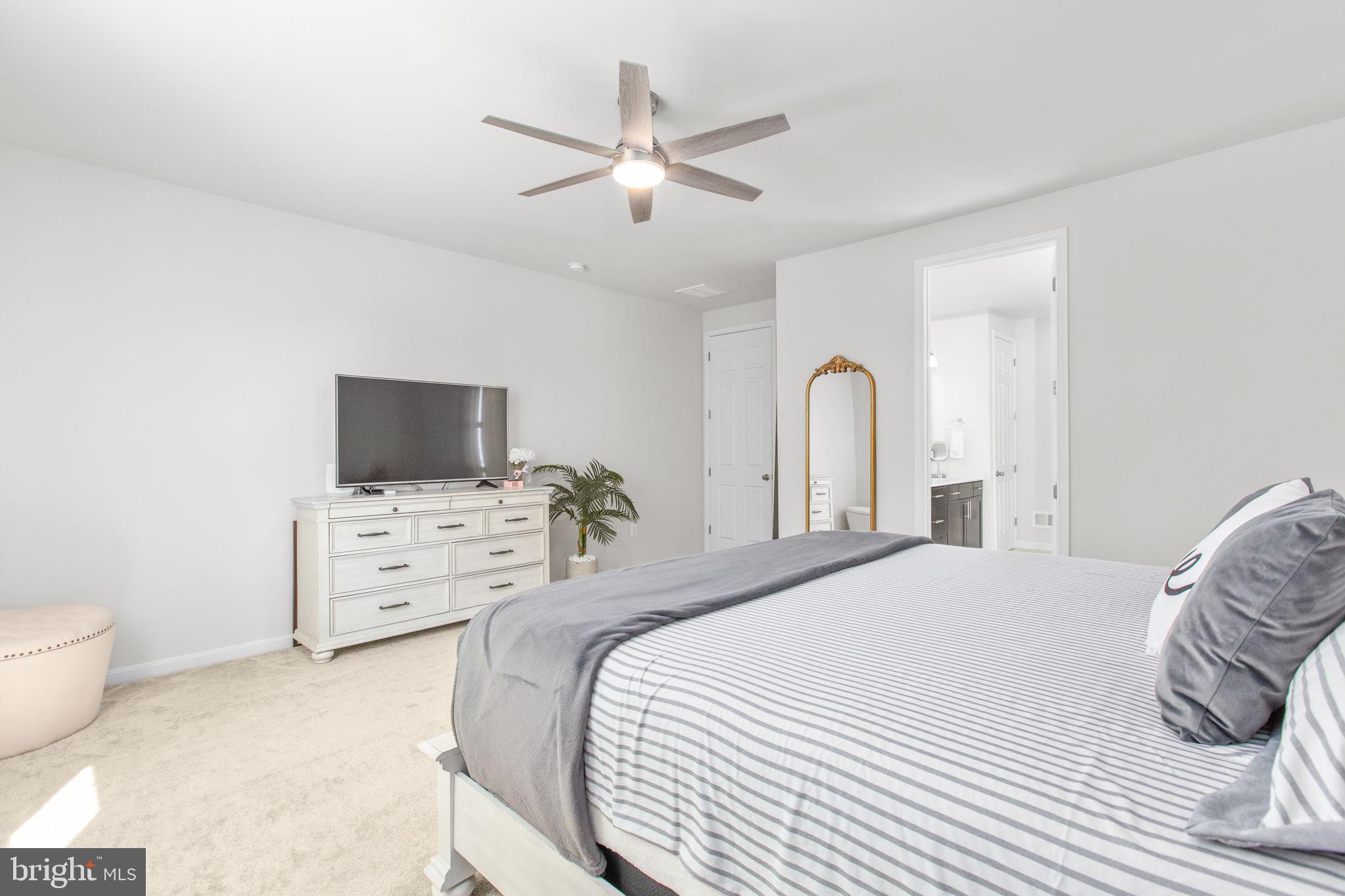 6306 Bobcat Lane King George, VA 22485 - Photo 17 of 58 a bedroom with a bed and a flat screen tv