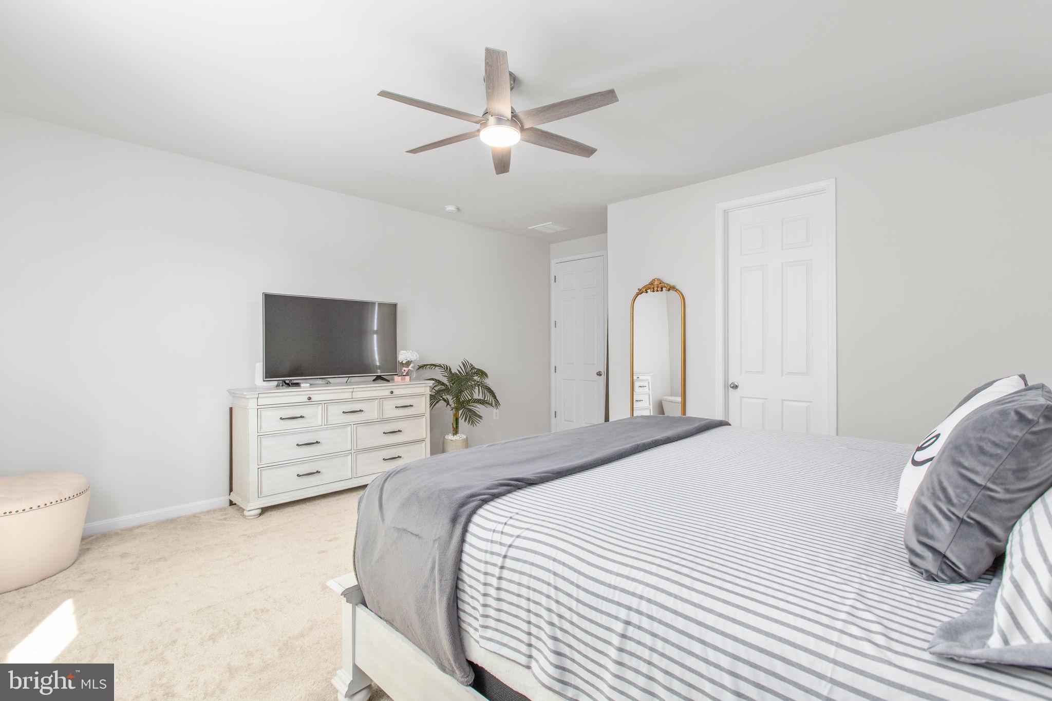 6306 Bobcat Lane King George, VA 22485 - Photo 18 of 58 a bedroom with a bed and a flat screen tv