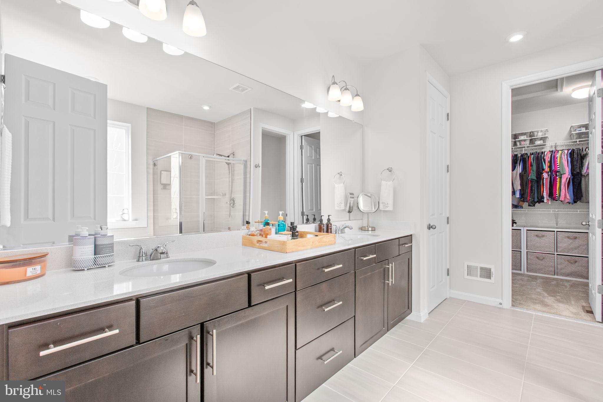 6306 Bobcat Lane King George, VA 22485 - Photo 20 of 58 a view of double vanity sink and a mirror