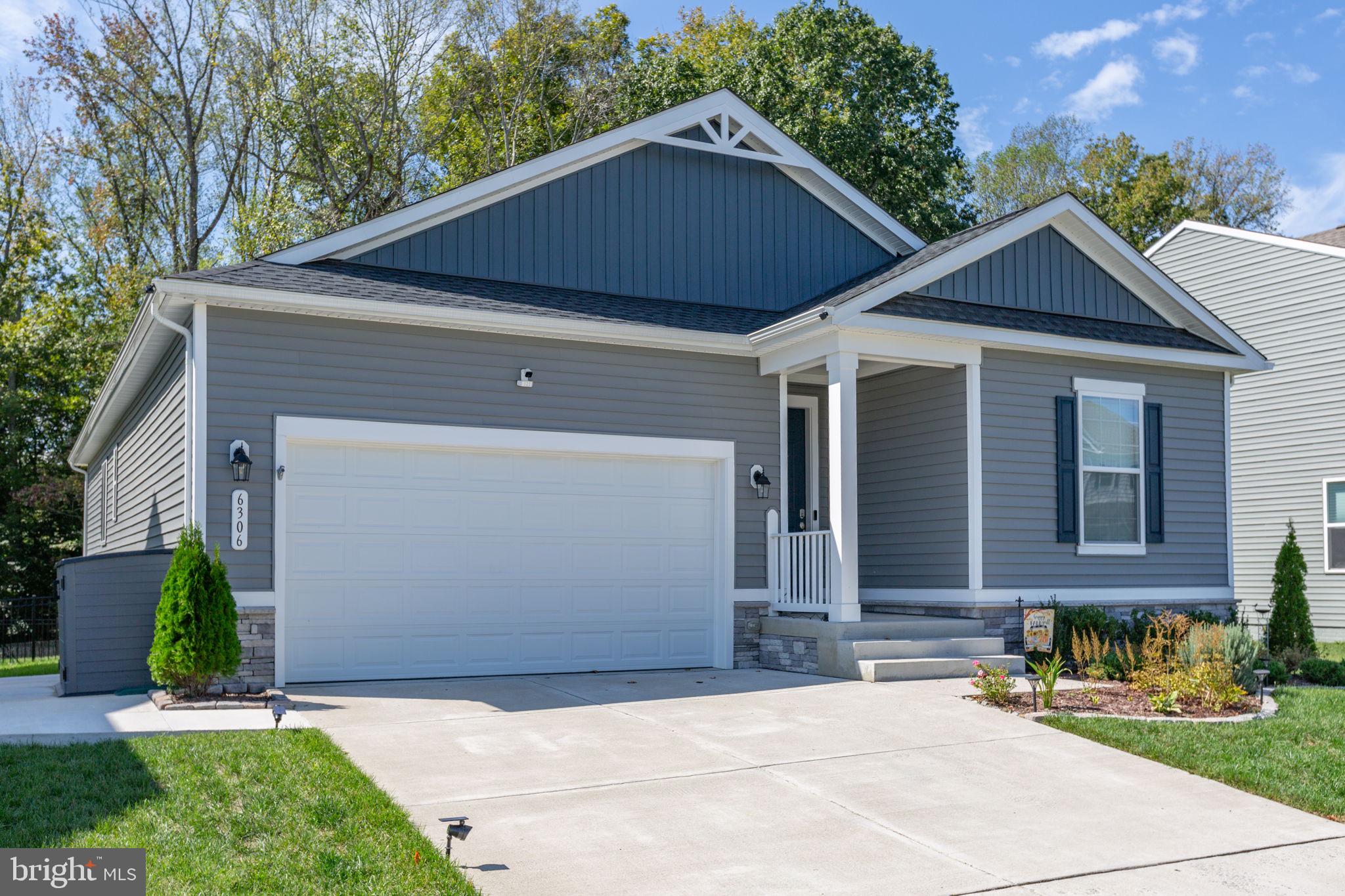 6306 Bobcat Lane King George, VA 22485 - Photo 2 of 58 a front view of a house with a yard