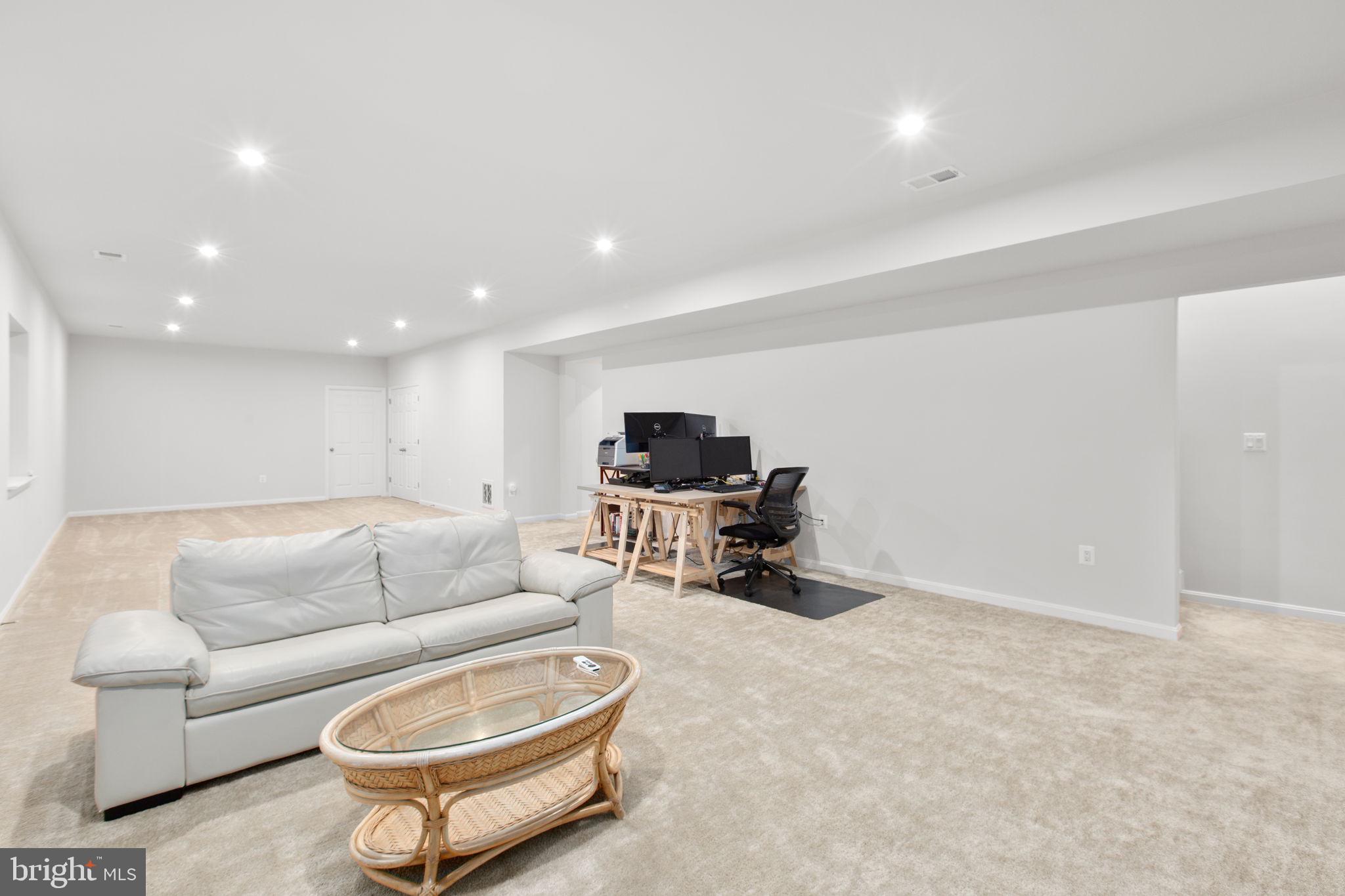 6306 Bobcat Lane King George, VA 22485 - Photo 27 of 58 a living room with furniture a flat screen tv and a window