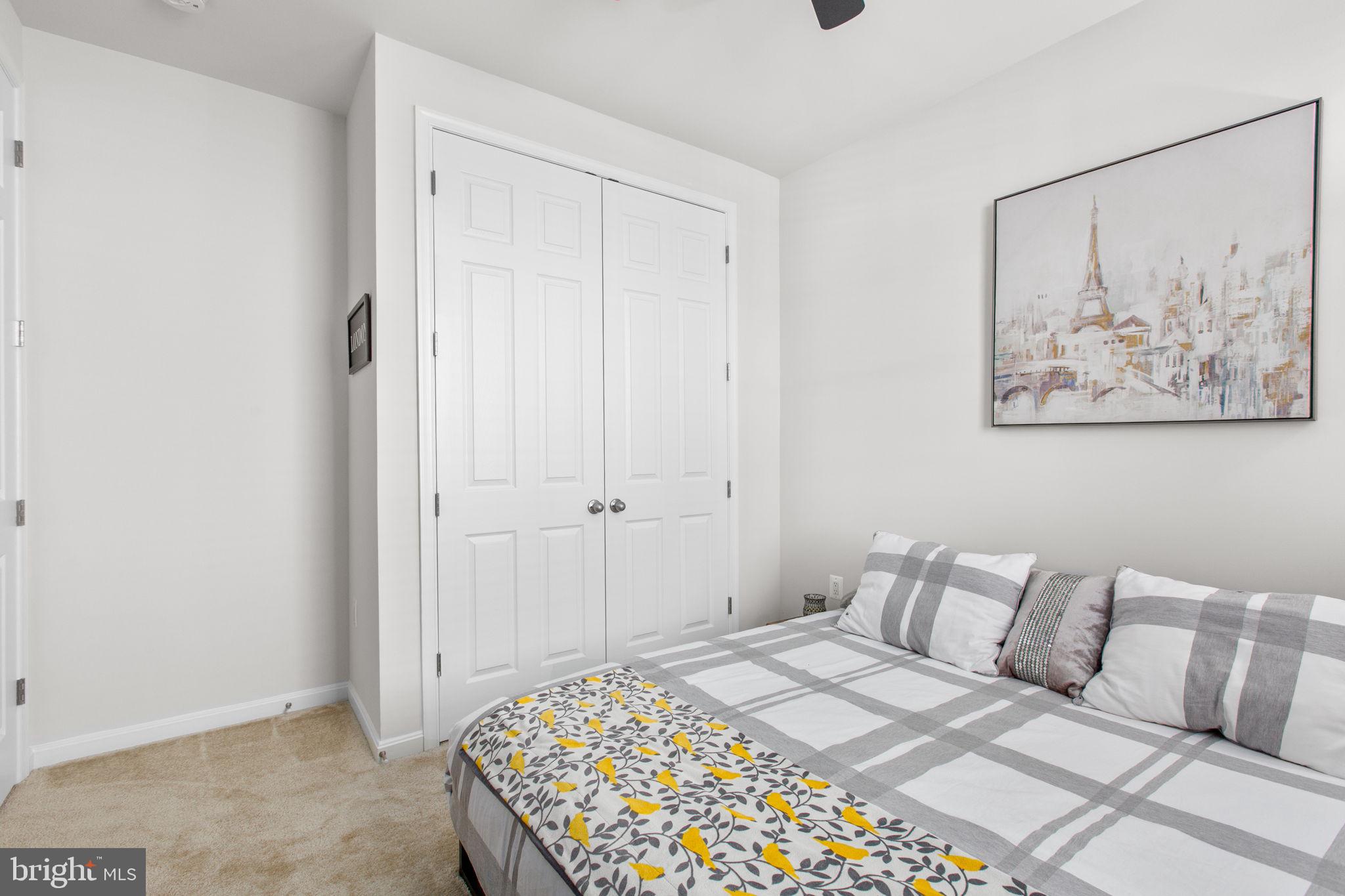 6306 Bobcat Lane King George, VA 22485 - Photo 29 of 58 a bedroom with a bed and a painting on the wall