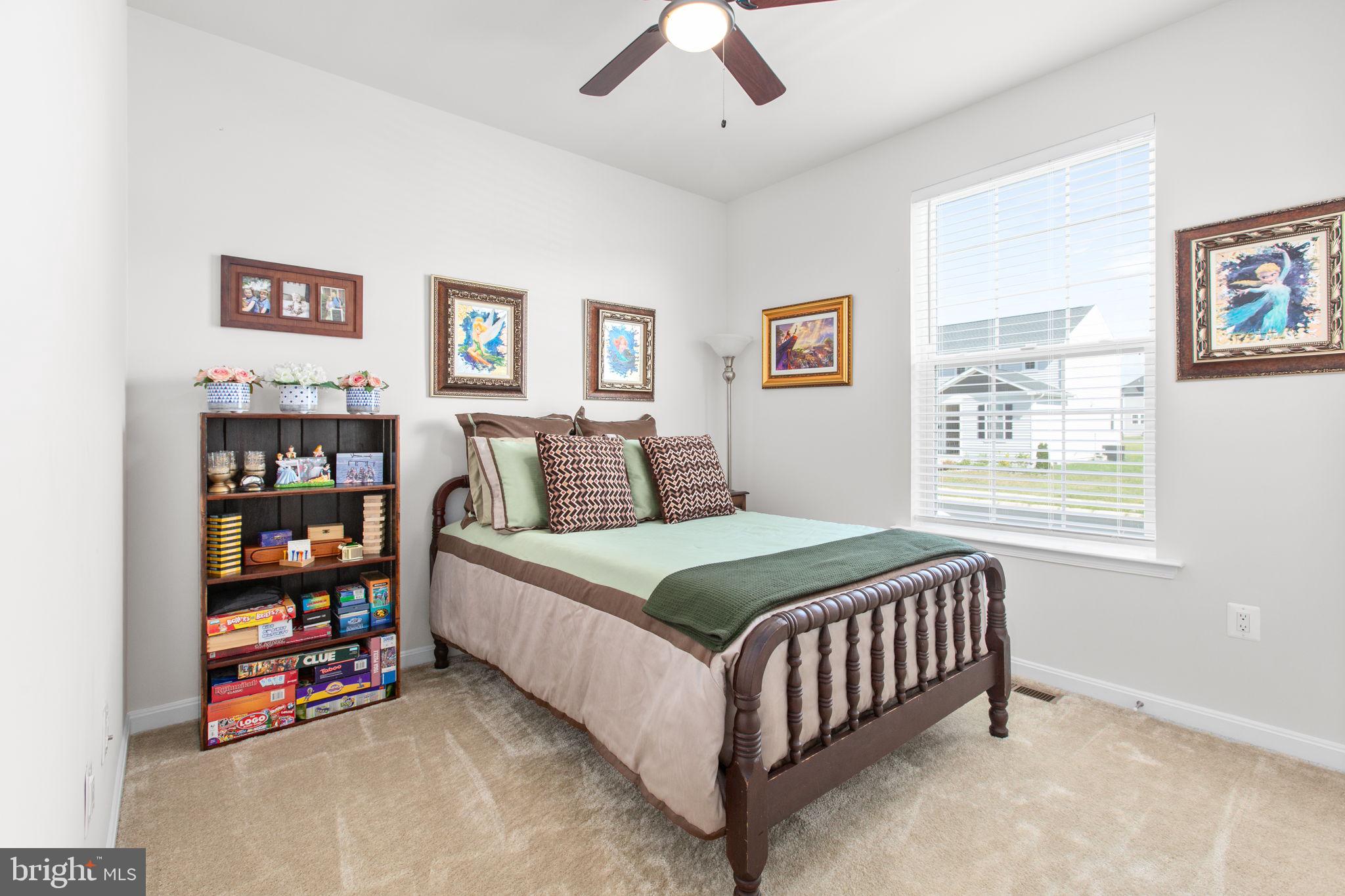 6306 Bobcat Lane King George, VA 22485 - Photo 30 of 58 a bedroom with a bed furniture and a window