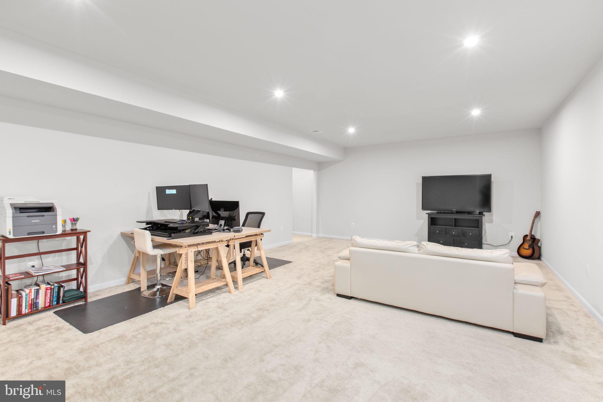 6306 Bobcat Lane King George, VA 22485 - Photo 36 of 58 a living room with furniture and a flat screen tv
