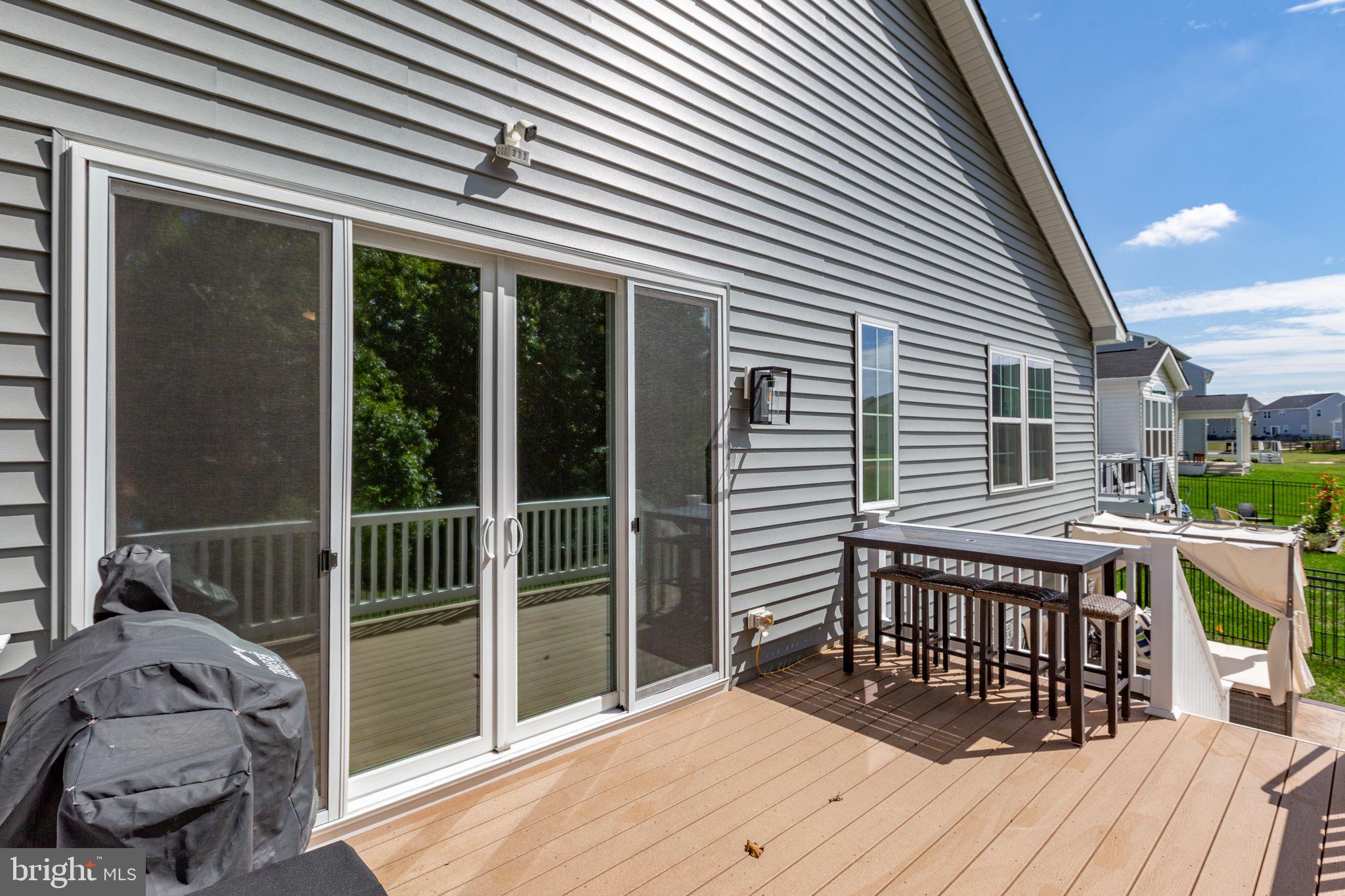6306 Bobcat Lane King George, VA 22485 - Photo 40 of 58 a balcony with furniture and wooden floor
