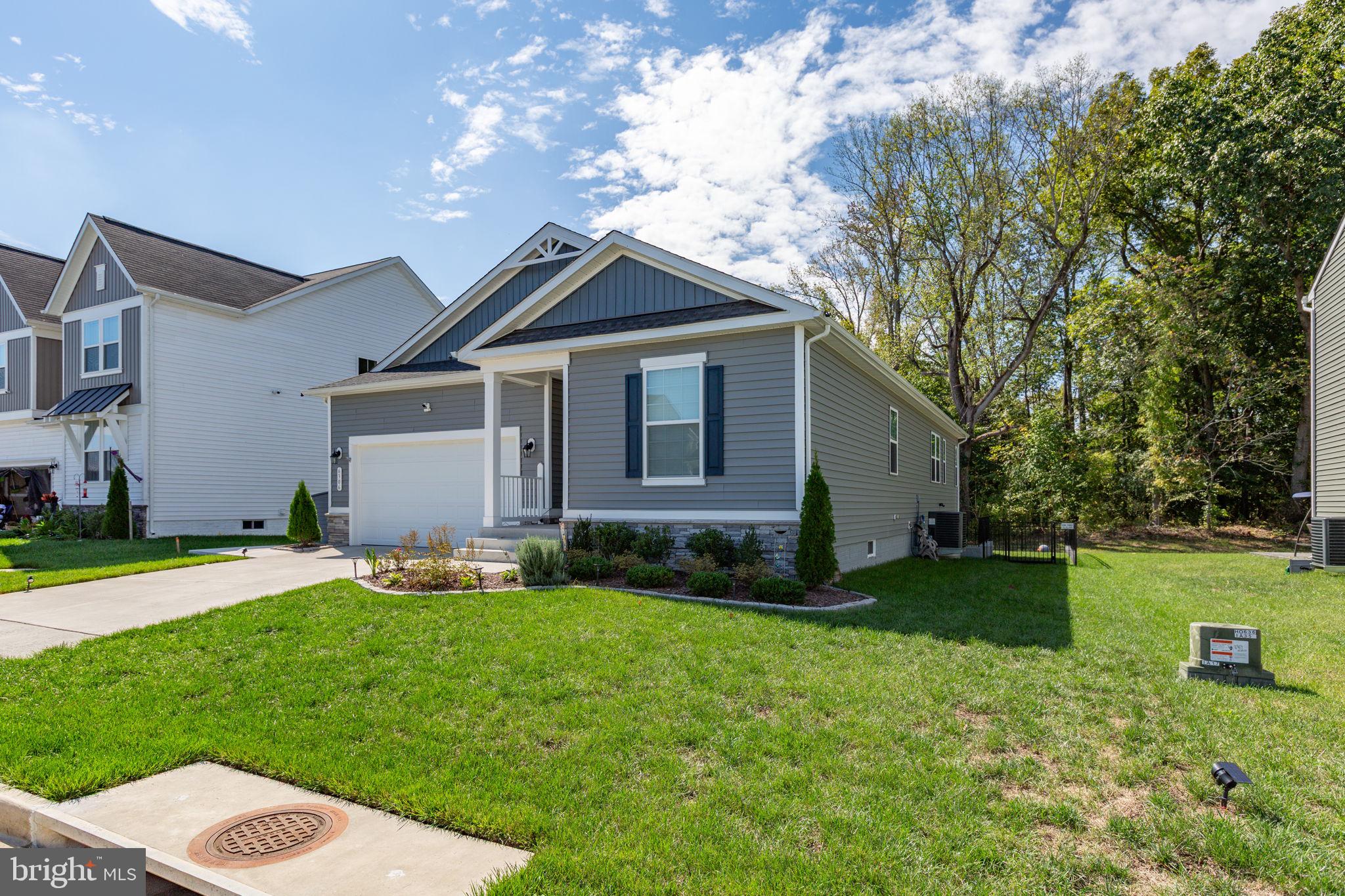 6306 Bobcat Lane King George, VA 22485 - Photo 52 of 58 a backyard of a house with garden and yard