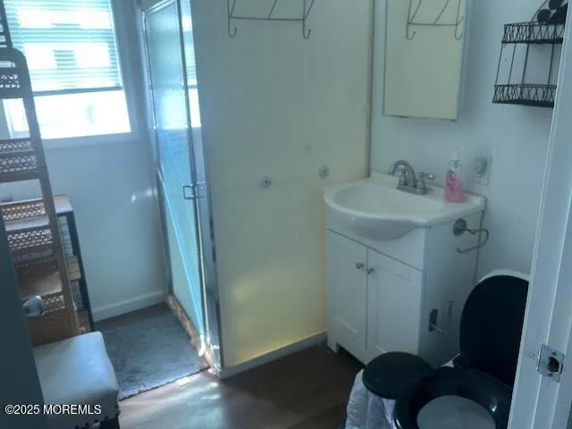 a bathroom with a tub and toilet
