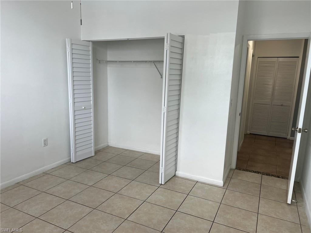 3841 Schoolhouse Road East, Unit 7 Fort Myers, FL 33916 - Photo 15 of 24 an empty room with closet