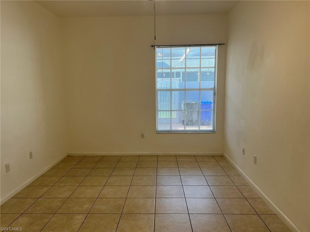 3841 Schoolhouse Road East, Unit 7 Fort Myers, FL 33916 - Photo 22 of 24 an empty room with windows