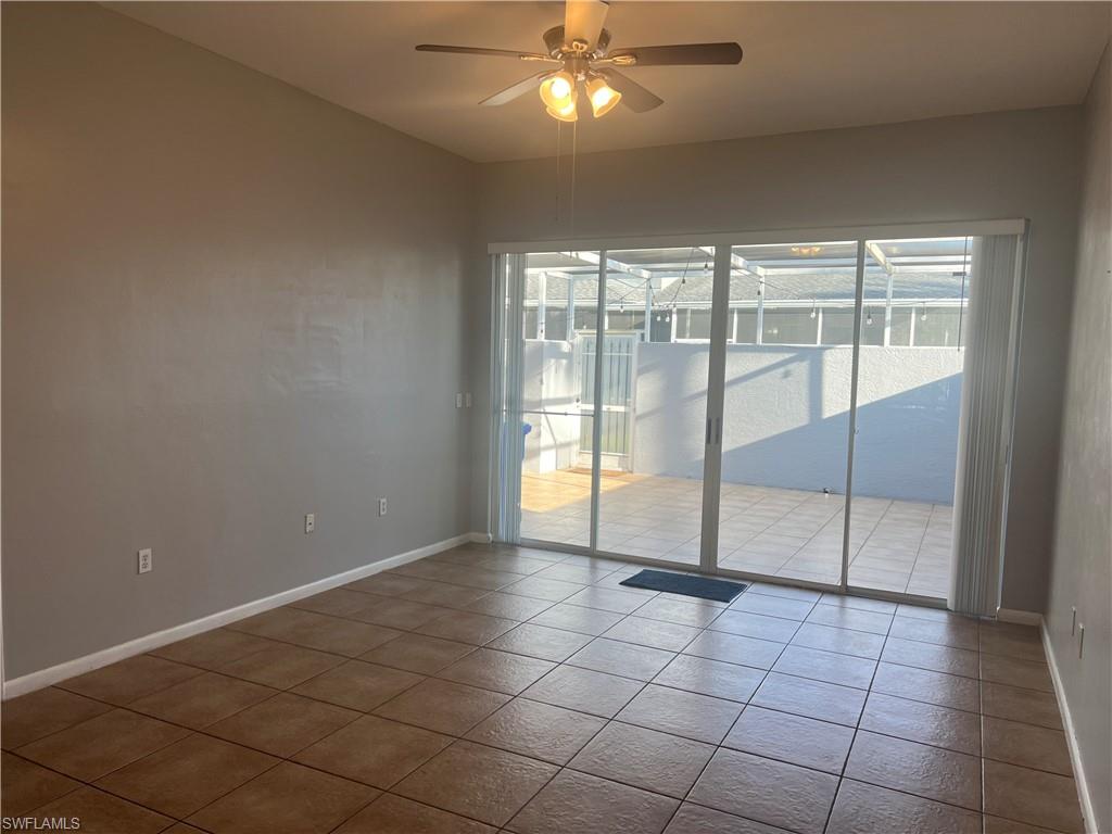 3841 Schoolhouse Road East, Unit 7 Fort Myers, FL 33916 - Photo 7 of 24 a view of an empty room with a window