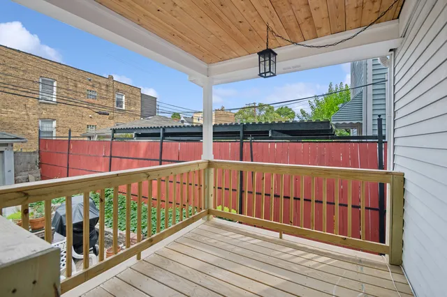 a view of balcony with wooden floor