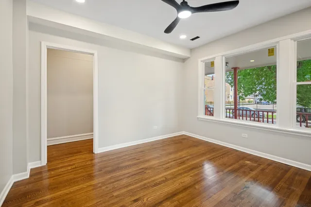 a view of an empty room with glass door