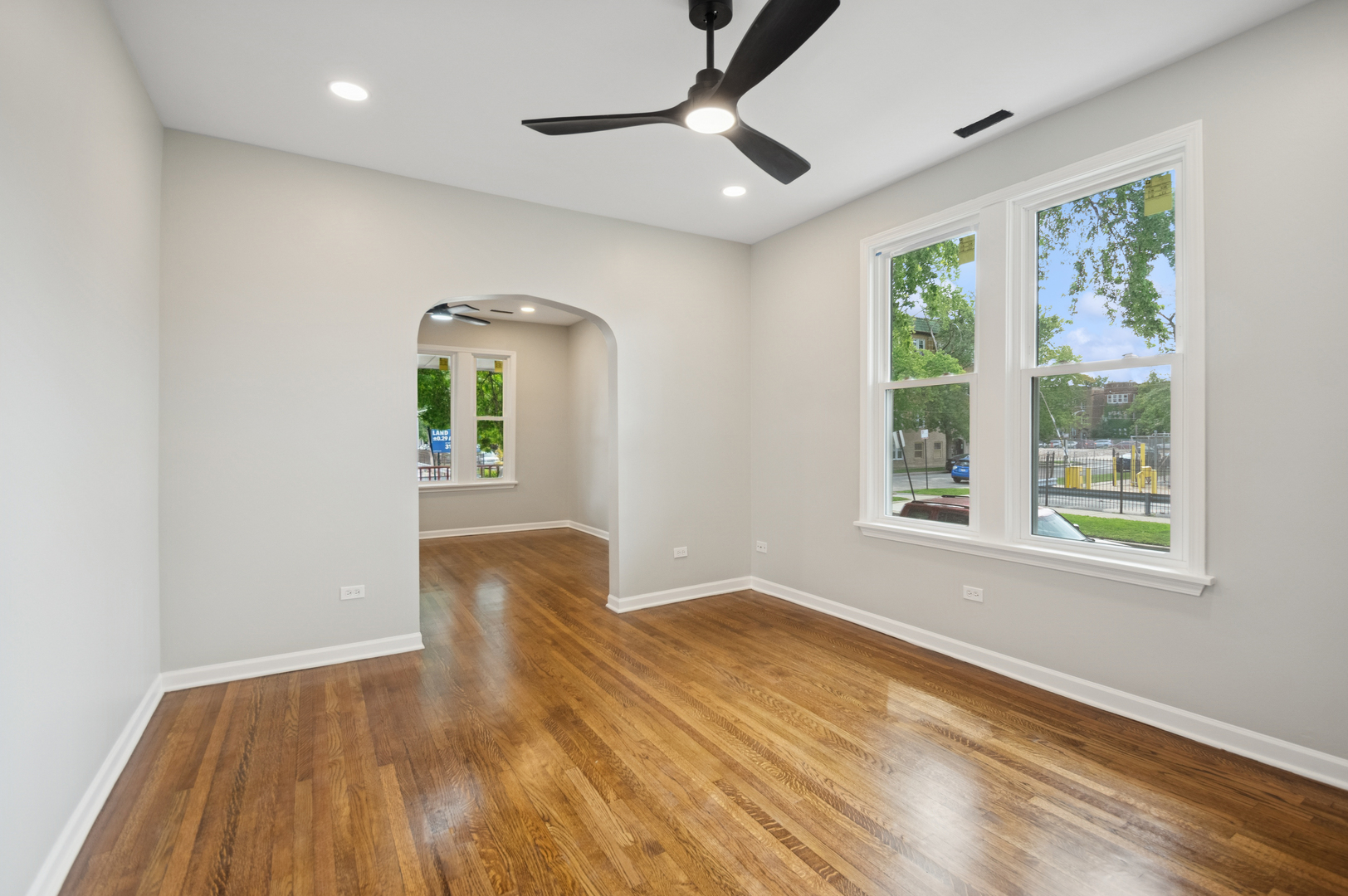 3300 North Karlov Avenue, Unit 1 Chicago, IL 60641 - Photo 5 of 17 a view of empty room with wooden floor and fan