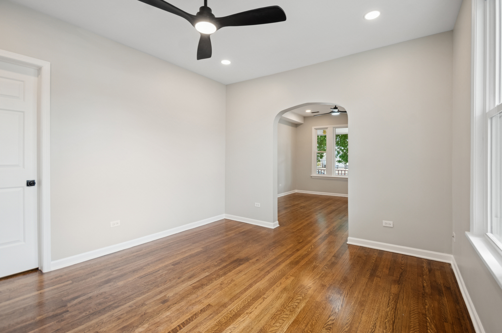 3300 North Karlov Avenue, Unit 1 Chicago, IL 60641 - Photo 6 of 17 wooden floor in an empty room with a window