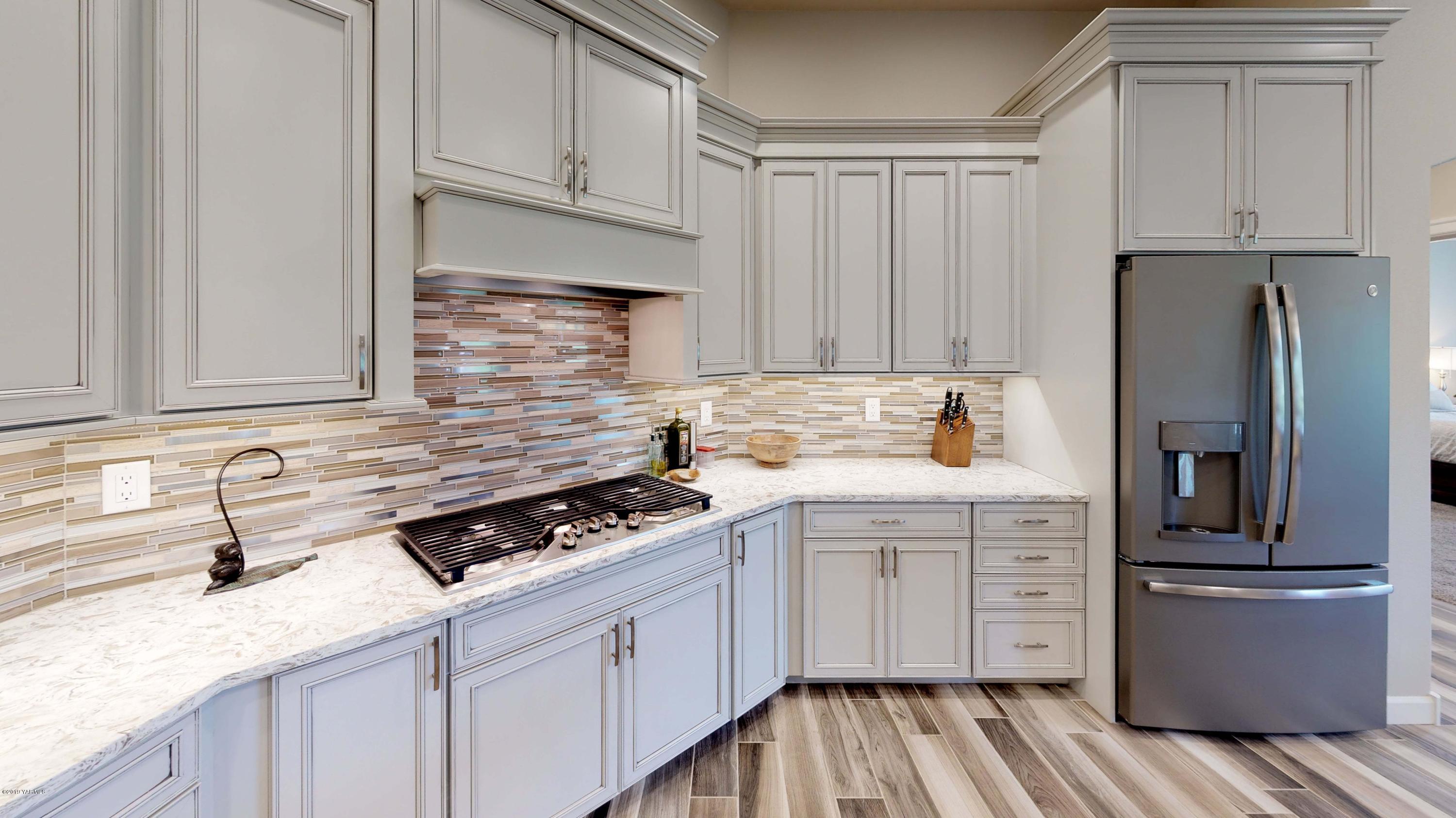 9104 Coolidge Road Yakima, WA 98903 - Photo 8 of 21 a kitchen with cabinets appliances and a counter space