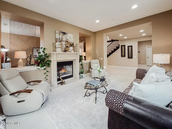 a kitchen with stainless steel appliances granite countertop a refrigerator a stove and a sink