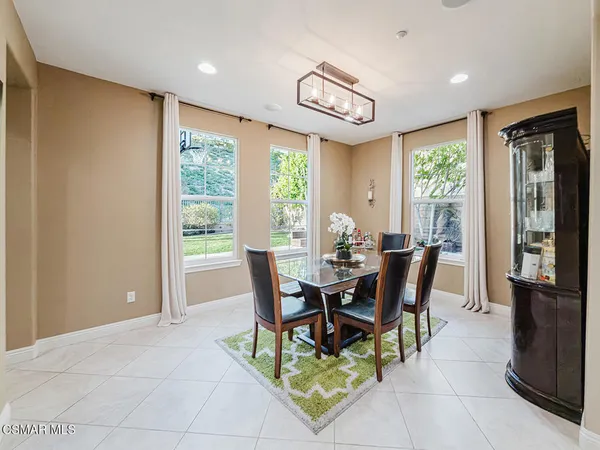 a living room with furniture hard wood floor and a fireplace