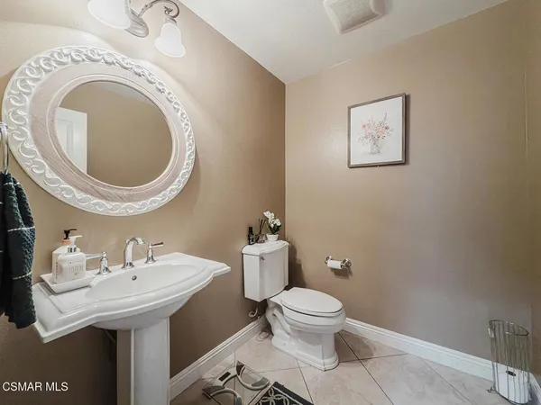 a bathroom with a glass shower door and a glass door