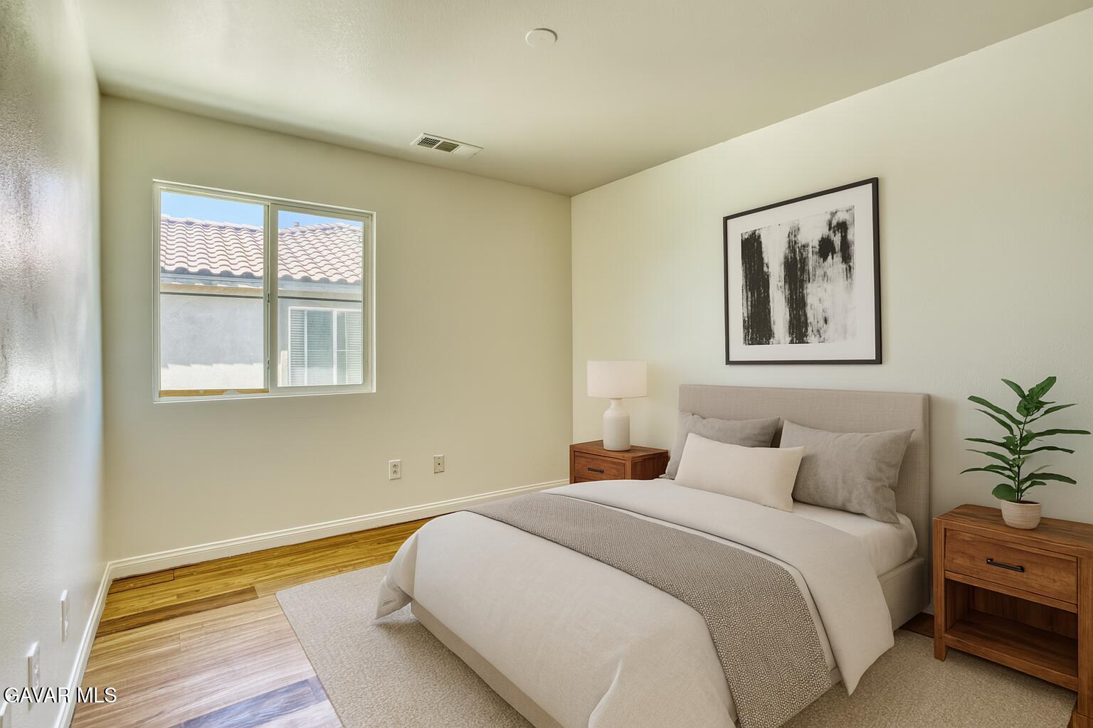 37928 Pisces Circle Palmdale, CA 93552 - Photo 19 of 32 a bedroom with a bed and a painting on the wall