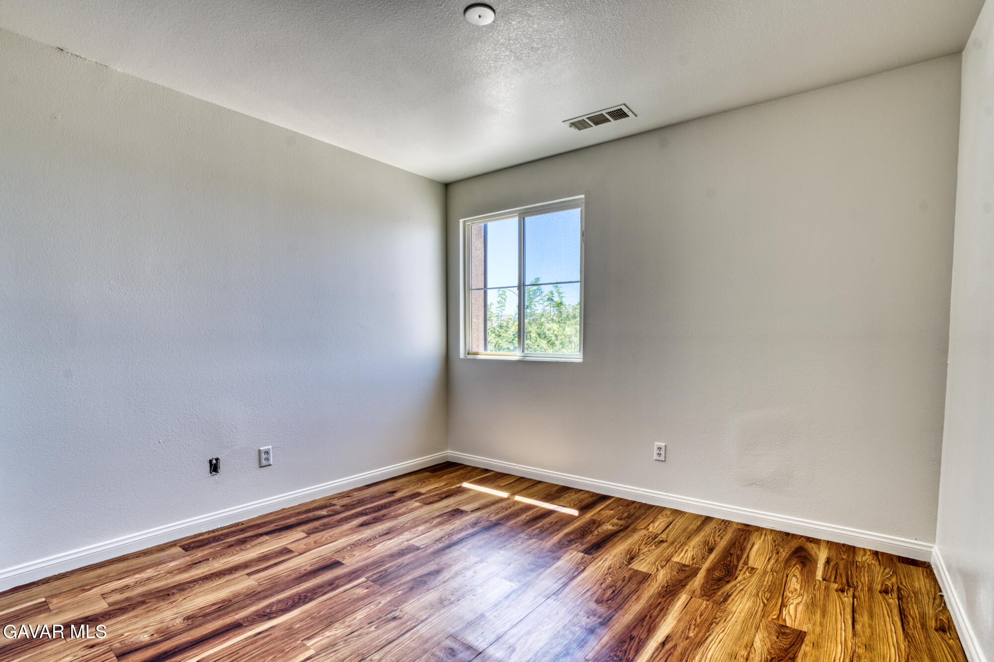37928 Pisces Circle Palmdale, CA 93552 - Photo 31 of 32 a view of empty room with wooden floor