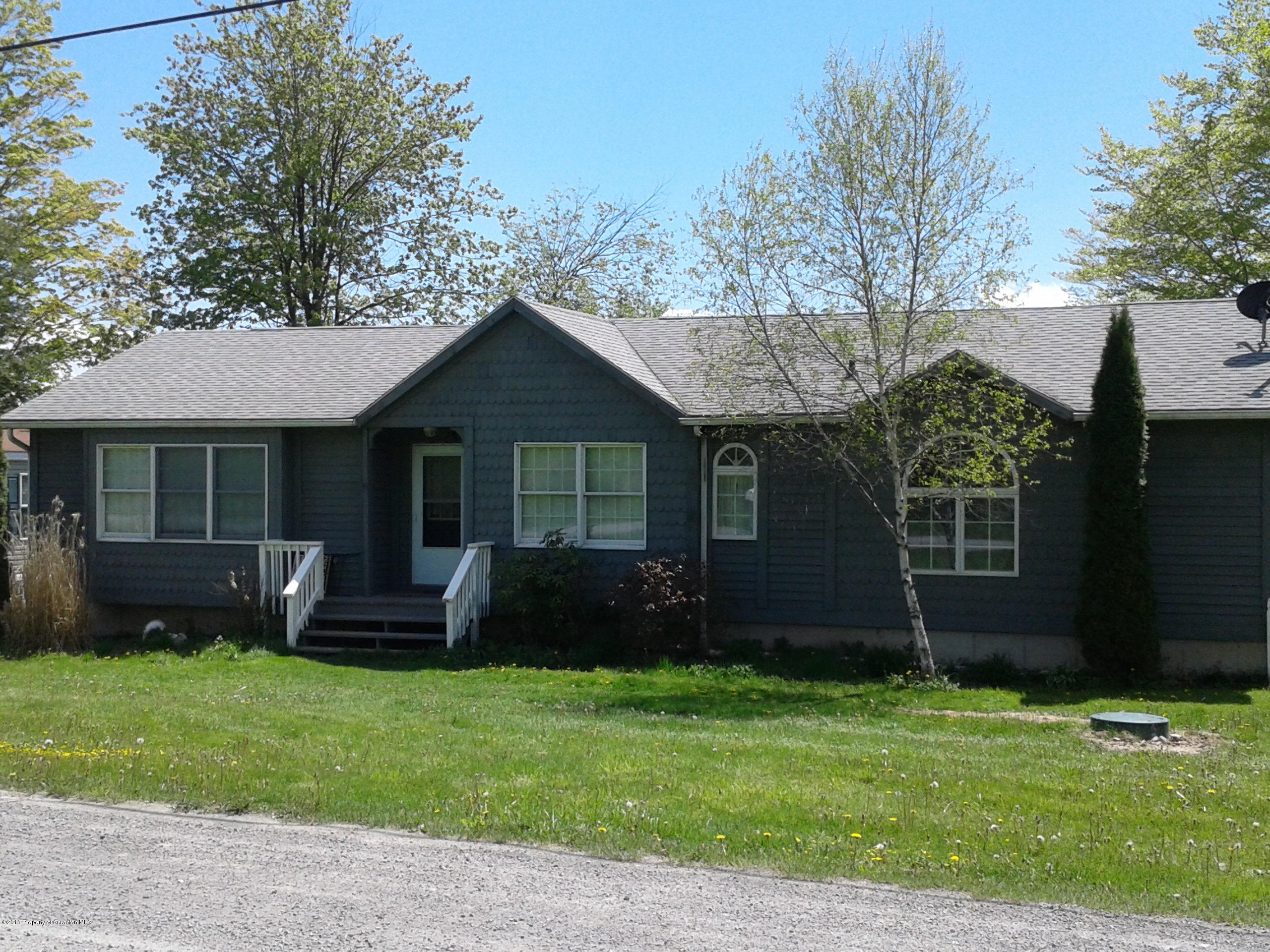 88 Lake Side Road Hop Bottom, PA 18824 - Photo 1 of 40 a front view of a house with a garden
