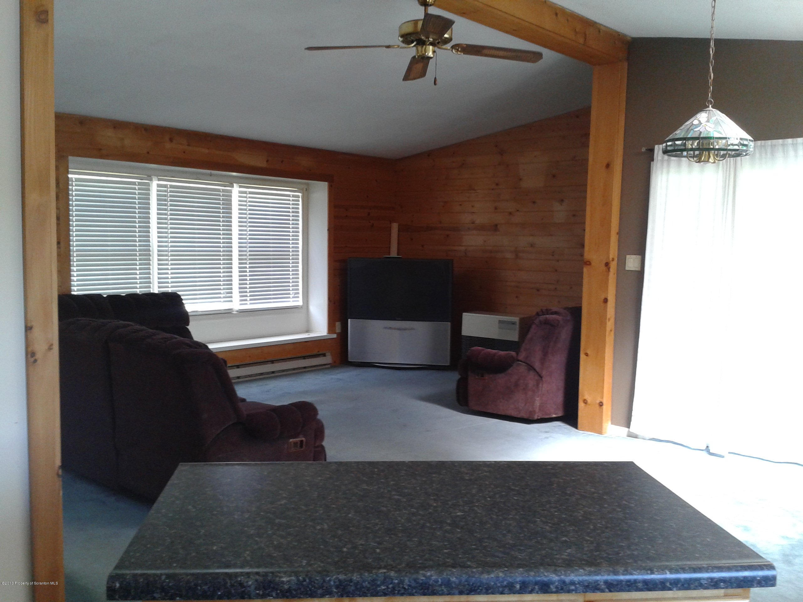 88 Lake Side Road Hop Bottom, PA 18824 - Photo 19 of 40 a living room with furniture and a window