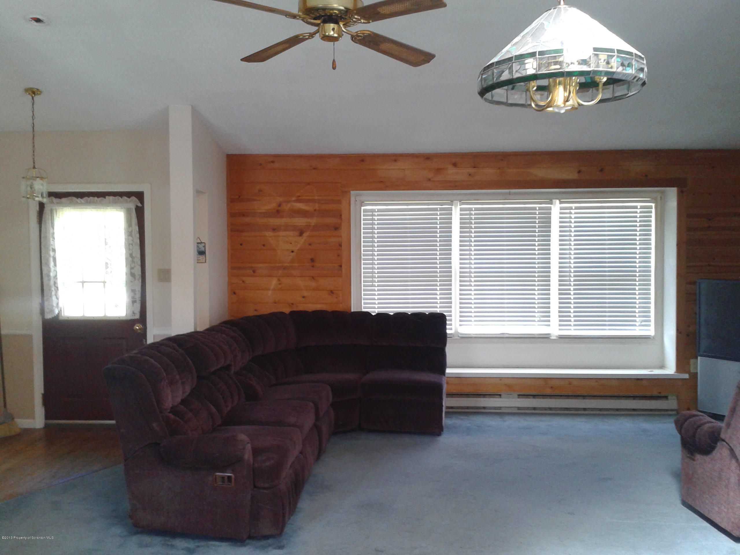 88 Lake Side Road Hop Bottom, PA 18824 - Photo 20 of 40 a living room with furniture and a window
