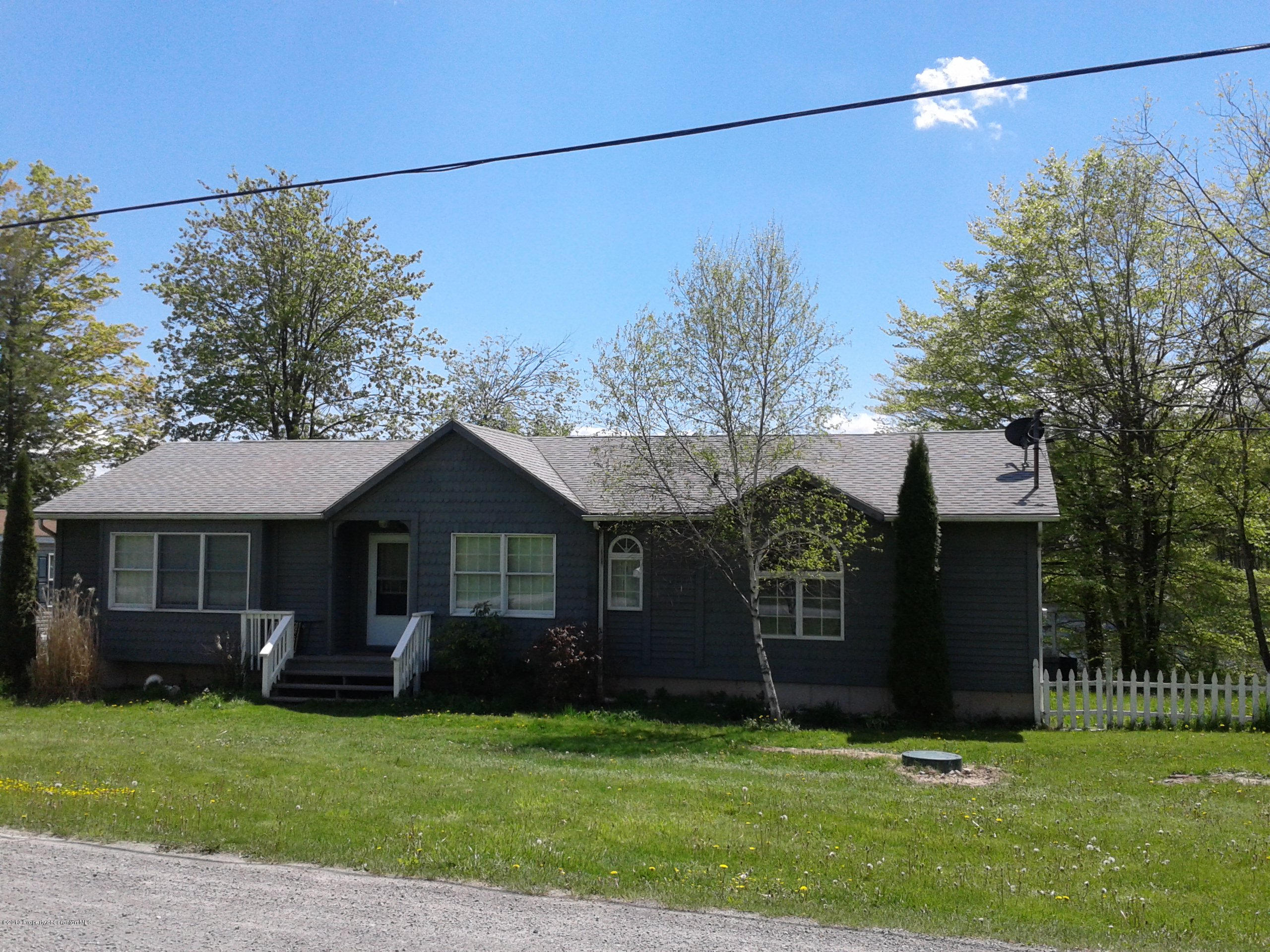 88 Lake Side Road Hop Bottom, PA 18824 - Photo 2 of 40 a front view of a house with a garden