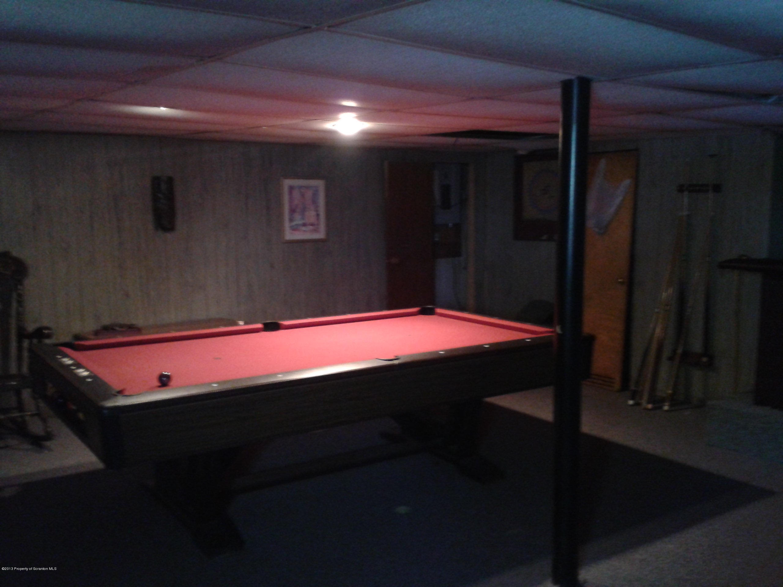 88 Lake Side Road Hop Bottom, PA 18824 - Photo 21 of 40 a room with a table and chairs