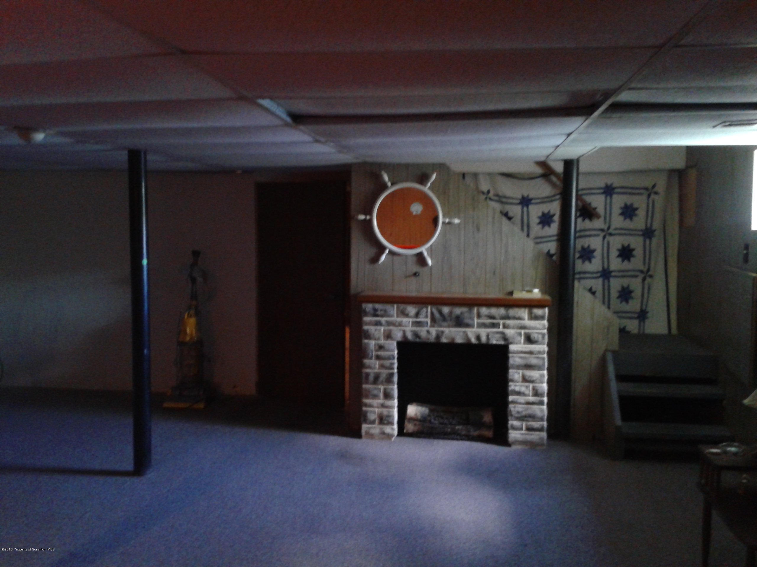 88 Lake Side Road Hop Bottom, PA 18824 - Photo 24 of 40 a view of fireplace with a wooden floor