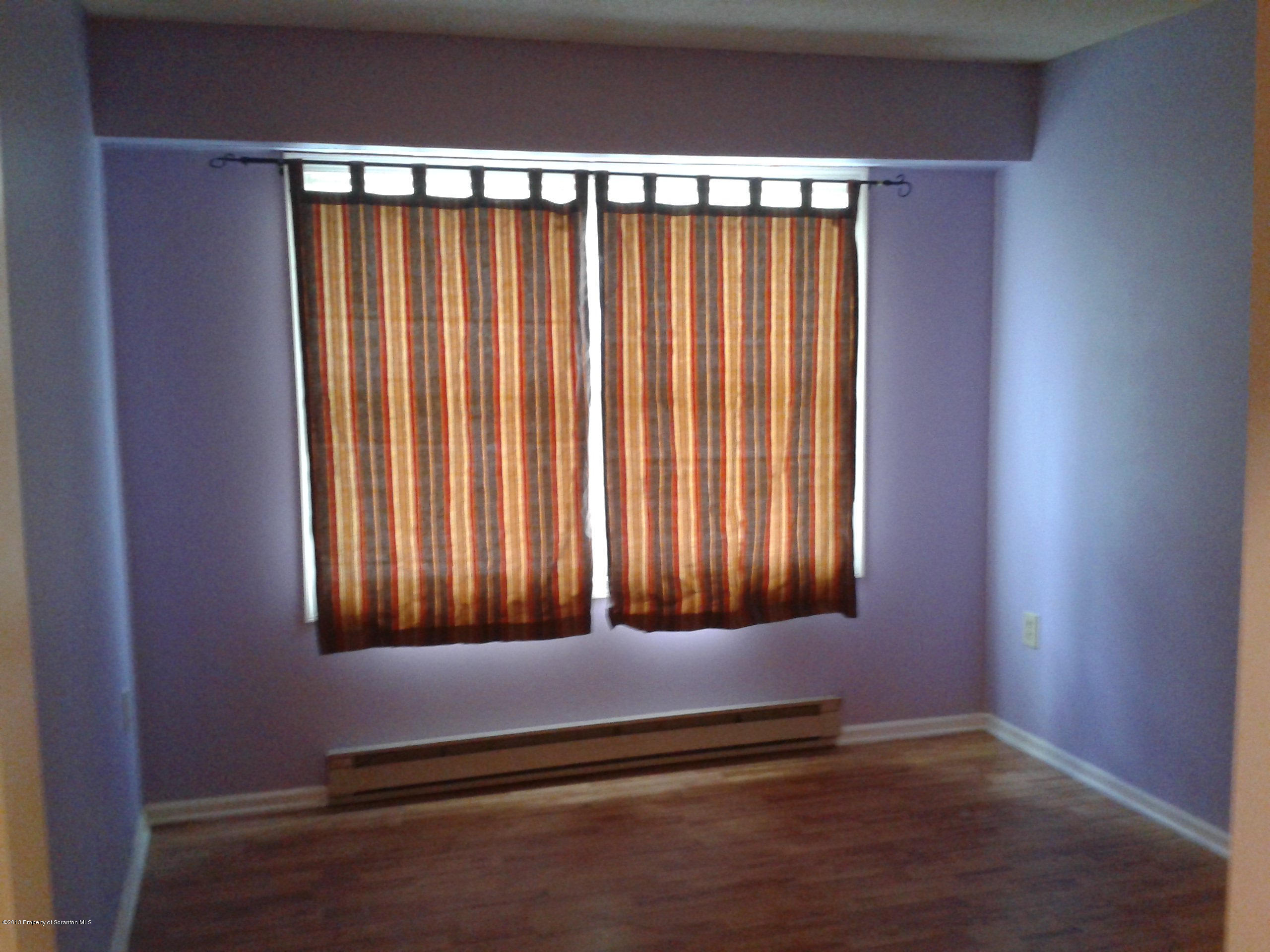 88 Lake Side Road Hop Bottom, PA 18824 - Photo 28 of 40 a view of a room with wooden floor and a window