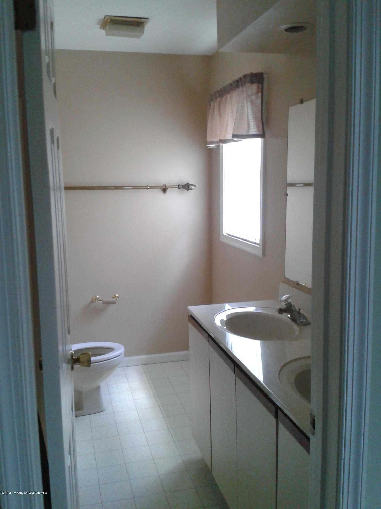 88 Lake Side Road Hop Bottom, PA 18824 - Photo 32 of 40 a bathroom with a sink and a mirror
