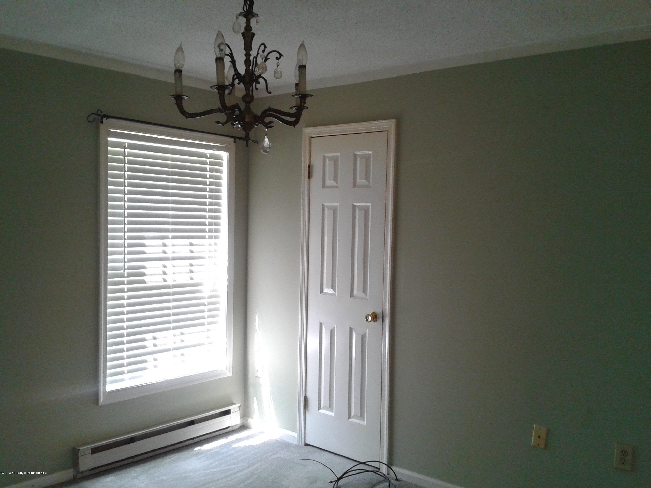 88 Lake Side Road Hop Bottom, PA 18824 - Photo 35 of 40 a view of a hallway with a chandelier
