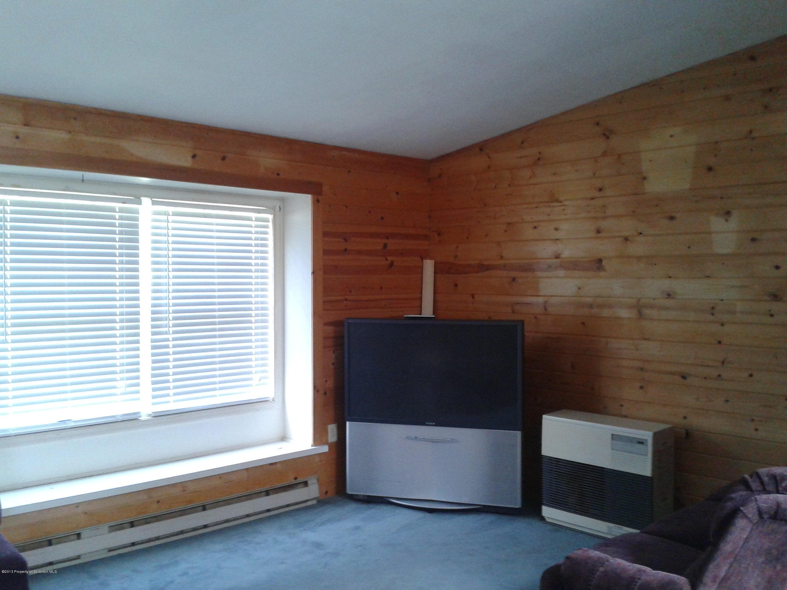 88 Lake Side Road Hop Bottom, PA 18824 - Photo 36 of 40 a living room with furniture and a flat screen tv